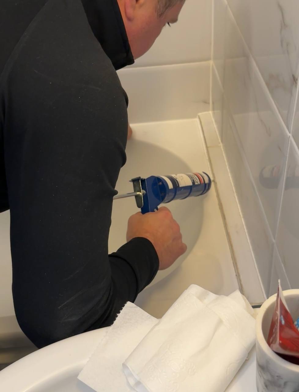 Remove old silicone and reseal with new silicone for bath, shower or sink.